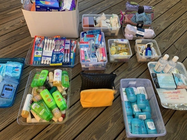 A picture of donations that Maya helped deliver to Shepherd's Table, including hygiene products and toiletries.