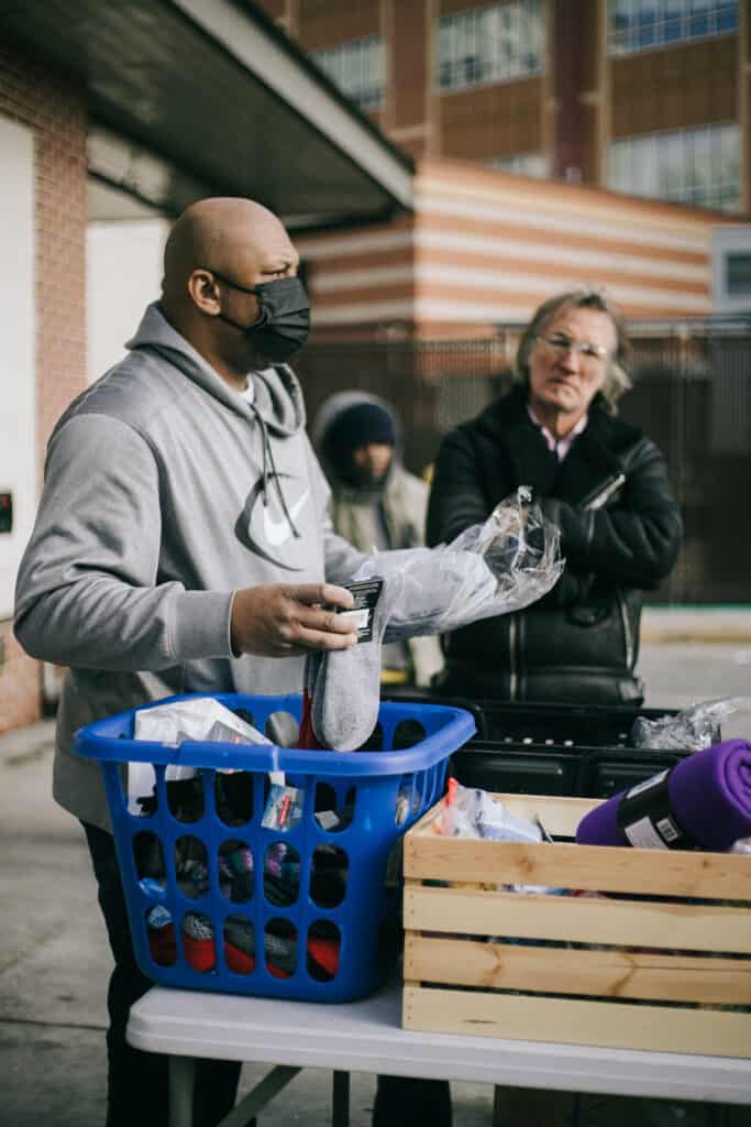 Jerome Chambers distributes winter clothing